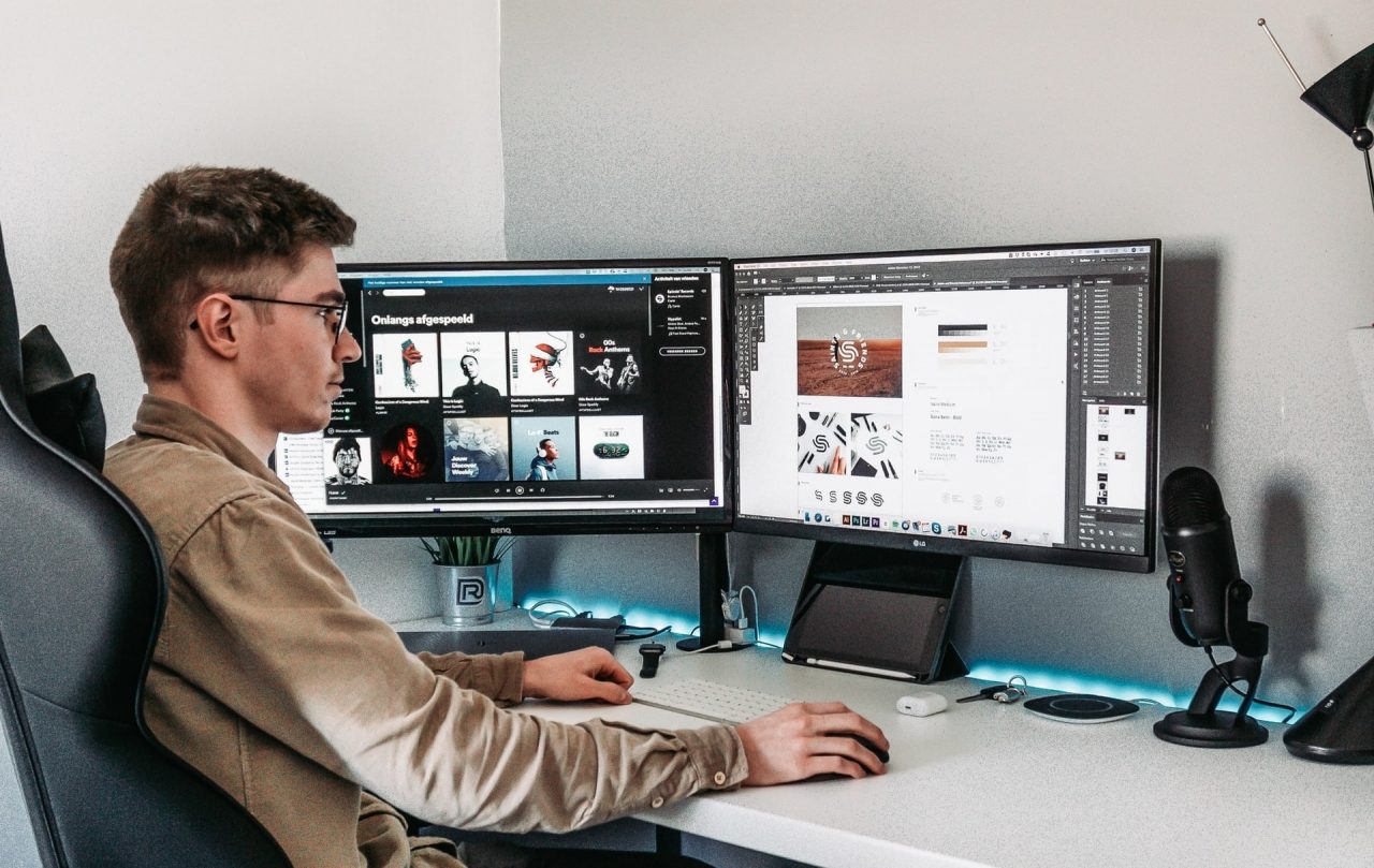 a graphic designer working at his desk